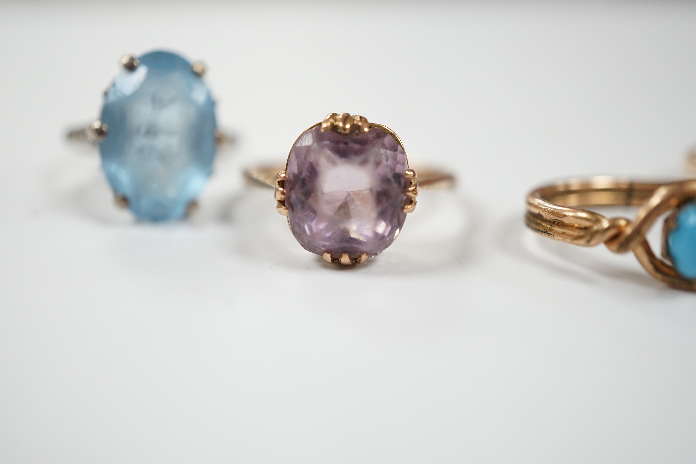Two yellow metal and gem set rings, one stamped 9ct, gross weight 7.7 grams and two other rings.